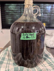 A one gallon carboy of stout.